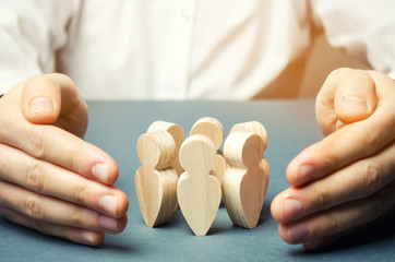 Boss defending his team with a gesture of protection. Life insurance. Customer care, care for...
