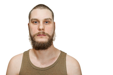 close-up portrait serious calm bearded not trimmed guy an isolated background