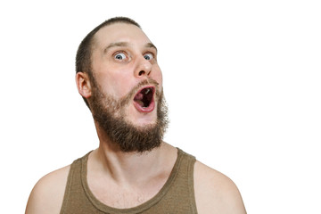 Very surprised scared funny face of a bearded guy with open mouth and big eyes on an isolated background