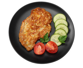 schnitzel with tomato and cucumber on black plate isolated on white background. top view.