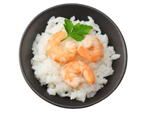 White rice with shrimps in black bowl isolated on white background. top view