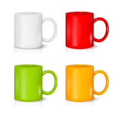Set of colored mugs on the white background