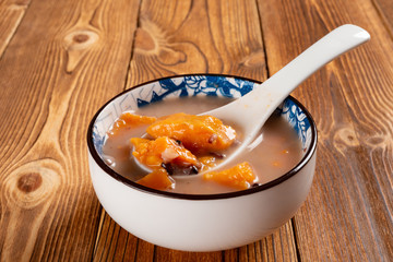 side view Chinese syrup of sweet potato and purple rice with lily bulbs