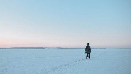 man walking at sunset