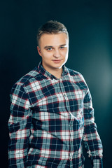 portrait of a young man on a dark background