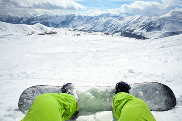 One snowboarder with snowboard on winter mountain