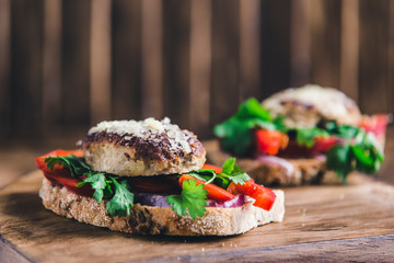 sandwich with cutlet, peppers onions and cheese