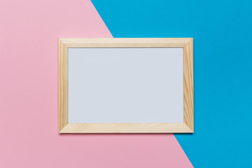 blank frame on a blue and pink background