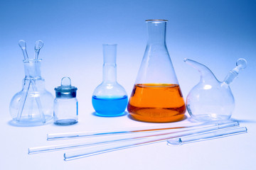 Laboratory chemical ware on a blue background