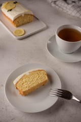 lemon cake with cream, cup of tea