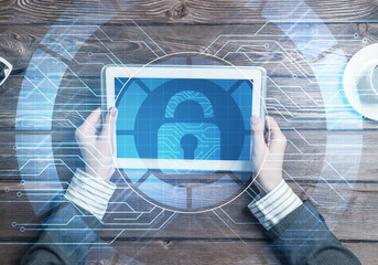 Concept of computer access with media lock icon on tablet screen