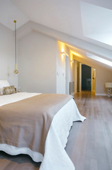 Bedroom with queen size bed with the lights on