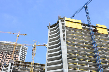 Construction site. High rise multi storey buildings under construction