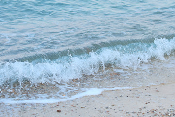 Beautiful sandy beach and soft blue ocean wave