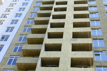 Residential multi store apartement building house facade under construction