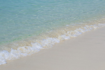 Beautiful sandy beach and soft blue ocean wave