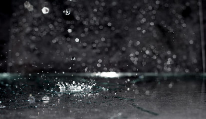 abstract background water drop, splashes on black background