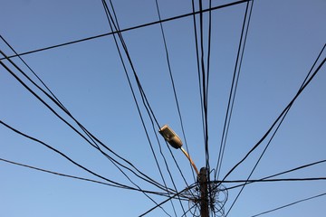 A tangle of electricity and communications cables, television aerials, satellite dishes in Prizren.