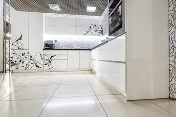 Modern white kitchen furniture. Painted front surface. The material used in the manufacture - MDF.