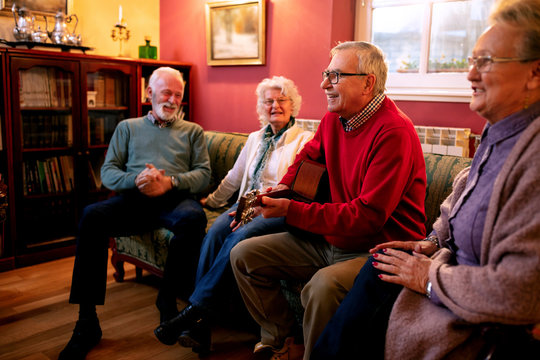 Old folks playing guitar and singing