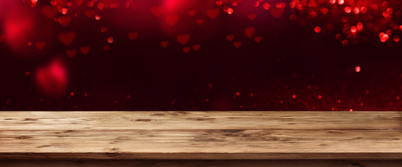 Table with dark background and red glowing hearts