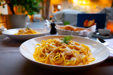 Two Plates with Carbonara Spaghetti in Italy.