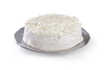 white cake on a gray plate isolated on white background