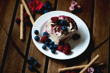 Crisp golden waffle served with whipped cream, vanilla ice cream and fresh blueberries and raspberries