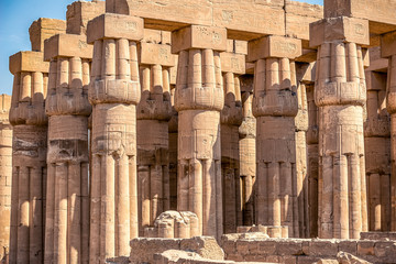 Columns of the ancient Egyptian temple on the blue sky background in Luxor