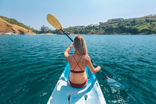 Woman kayaking in Thailand