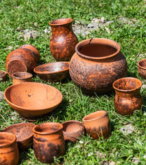 Fototapeta premium Craft pottery dairy roasting on the grass in the Altai, Russia