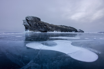Fototapeta na wymiar Air bubbles frozen in the ice near Oikoy Island of Lake Baikal