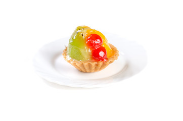 fruit jelly cake on a white plate isolated on white background