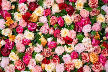 wedding decoration - close up of colorful artificial flowers wall background