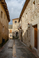 Fototapeta na wymiar Street and Castle of Pedraza in Segovia, Spain