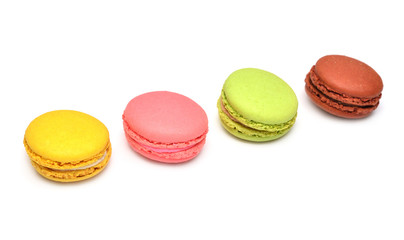 Beautiful macaroons multicolored isolated on white background. French confection