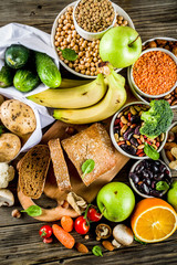 Healthy food. Selection of good carbohydrate sources, high fiber rich food. Low glycemic index diet. Fresh vegetables, fruits, cereals, legumes, nuts, greens.  copy space