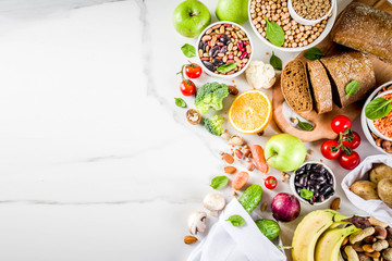Healthy food. Selection of good carbohydrate sources, high fiber rich food. Low glycemic index diet. Fresh vegetables, fruits, cereals, legumes, nuts, greens.  copy space