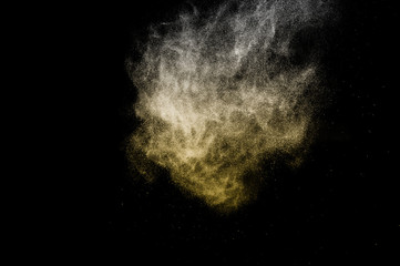 golden powder effect splash for makeup artist or graphic design in black background