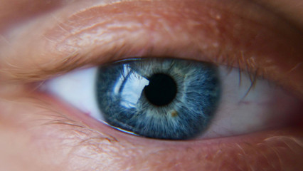 The blue of the human eye is very closely represented by the pulsation of the eye and blinking. Concept of: Sky blue, Close to the eye, Man, Woman.