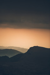 Breathtaking sunset views from Bucegi National Park in Romania.Mountain peak silhouette