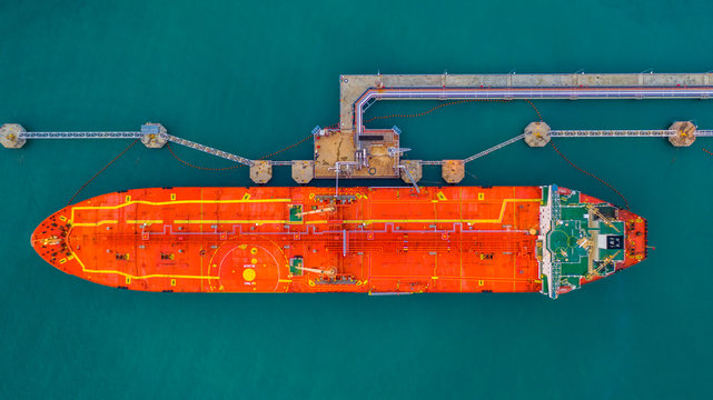 Tanker ship loading in port view from above, Tanker ship logistic import export business and transportation, Aerial view.