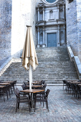 Emty street cafe against catheral in Girona, Spain