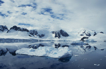 Fototapeta na wymiar Antarctica; landscape with mountians reflecting in water