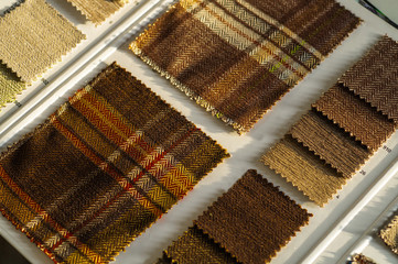 Celtic plaid background. Catalog of multicolored cloth from matting fabric texture background