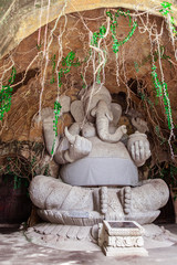 Stone Ganesh sculpture in cave in Bali, Indonesia