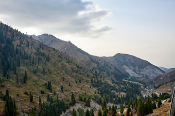 Obraz premium Kazakhstan. Cableway from Chimbulak. Downstairs Small Almatinka and the bridge to the hot spring Gorelnik