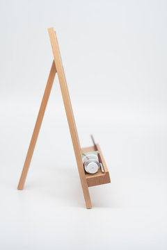 An isolated wooden easel
