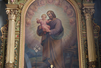 Saint Joseph holding child Jesus altarpiece in the Basilica of the Sacred Heart of Jesus in Zagreb,...