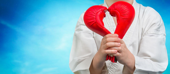	Valentine's Day.The boy athlete karate gives heart